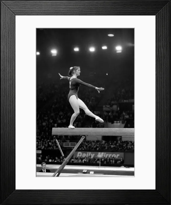 Framed Print : A competitor on the beam in the Champions All'Gymnastics Competition Framed Print : A competitor on the beam in the Champions All'Gymnastics Competition