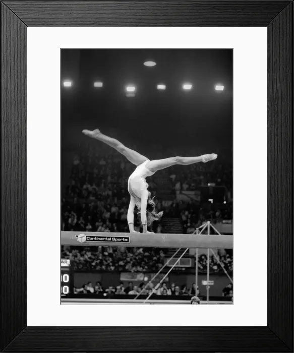 Framed Print : Nadia Comaneci competiting in Champions All'Gymnastics Competition