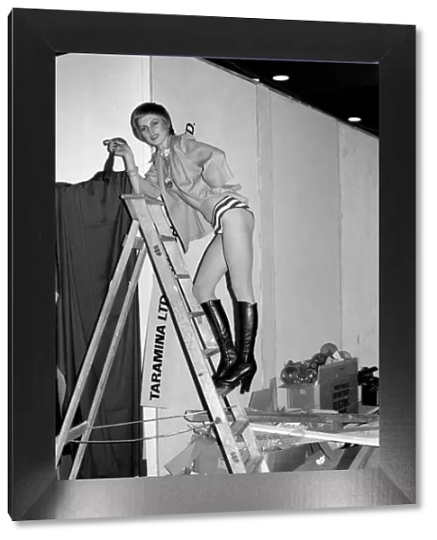 London Fashion Fair International: Model Laura Venner, 22 helping to fix up the stand for