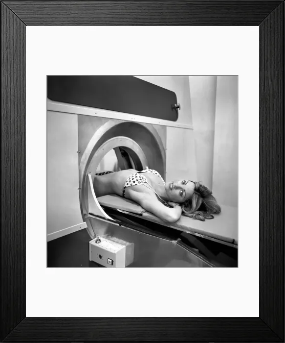 Framed Print : Model Gillian Duxbury in E. M. I. X-Ray scanner. April 1975 75-1905-004 Framed Print : Model Gillian Duxbury in E. M. I. X-Ray scanner. April 1975 75-1905-004