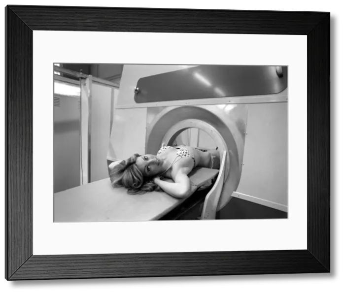 Framed Print : Model Gillian Duxbury in E. M. I. X-Ray scanner. April 1975 75-1905-007