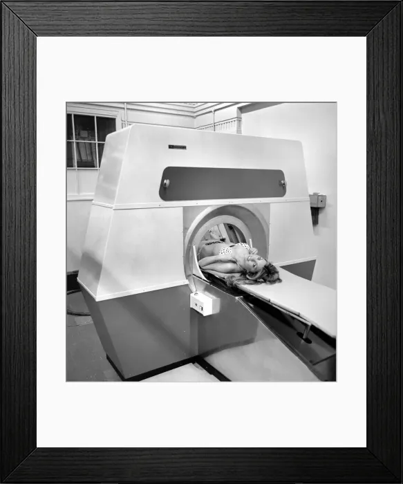 Framed Print : Model Gillian Duxbury in E. M. I. X-Ray scanner. April 1975 75-1905-002 Framed Print : Model Gillian Duxbury in E. M. I. X-Ray scanner. April 1975 75-1905-002