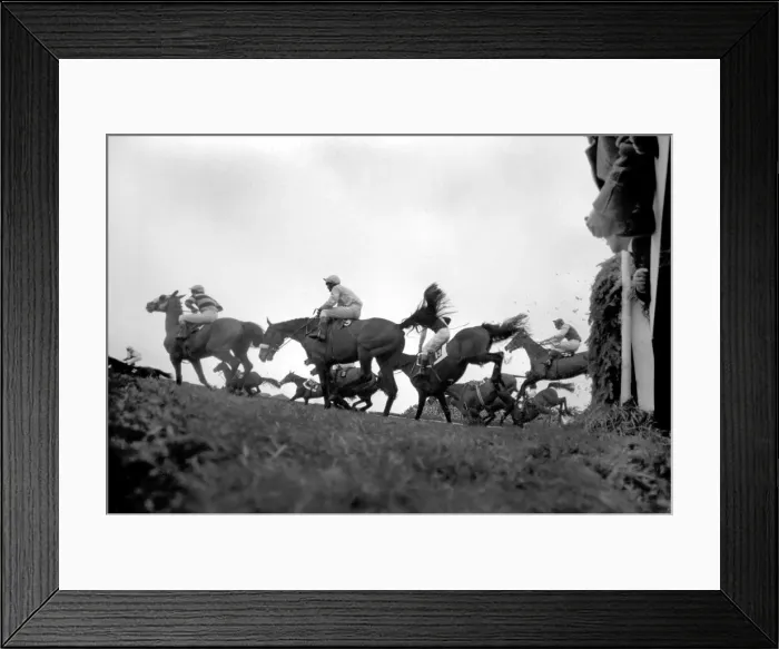 Framed Print : The Grand National at Aintree: Landing after jumping the canal turn is the eventual Framed Print : The Grand National at Aintree: Landing after jumping the canal turn is the eventual