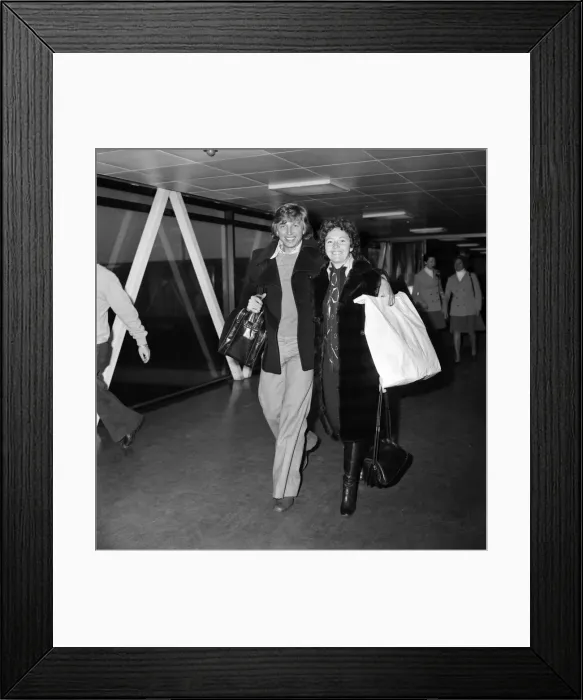 Framed Print : Tommy Steele and his wife, Anne, at Heathrow Airport after arriving from the south of