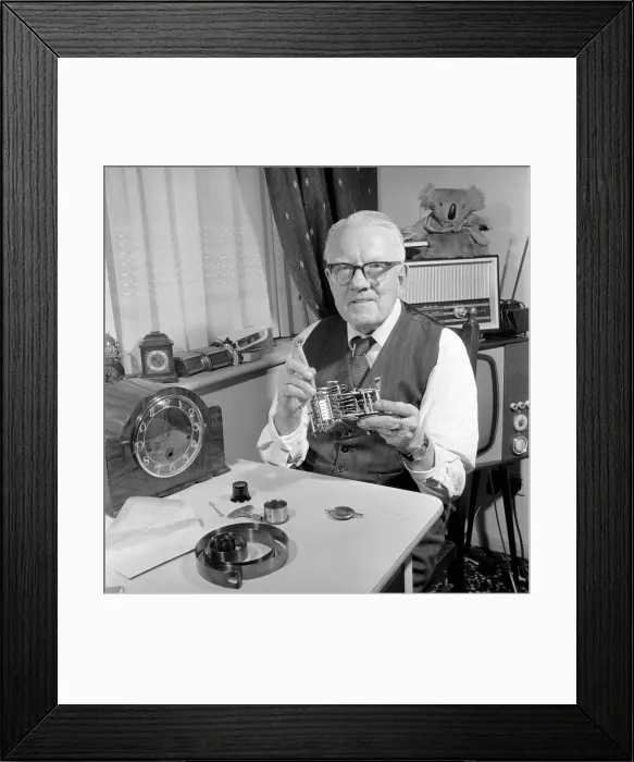 Framed Print : Timelord: Clock repairer Bill Marshall seen here repairing the movement to a mantle clock Framed Print : Timelord: Clock repairer Bill Marshall seen here repairing the movement to a mantle clock