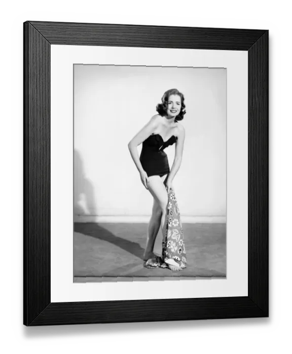 Framed Print : Clothing: Fashion: Beachwear: Women modelling beach robe that can convert into a bag or a Framed Print : Clothing: Fashion: Beachwear: Women modelling beach robe that can convert into a bag or a
