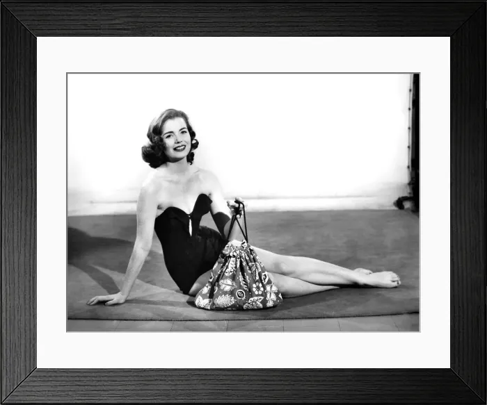Framed Print : Clothing: Fashion: Beachwear: Women modelling beach robe that can convert into a bag or a