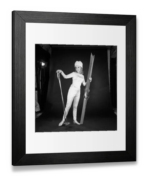 Framed Print : Clothing: Fashion: Woman wearing skiing outfit converted from wedding dress. 1963 B1578a Framed Print : Clothing: Fashion: Woman wearing skiing outfit converted from wedding dress. 1963 B1578a