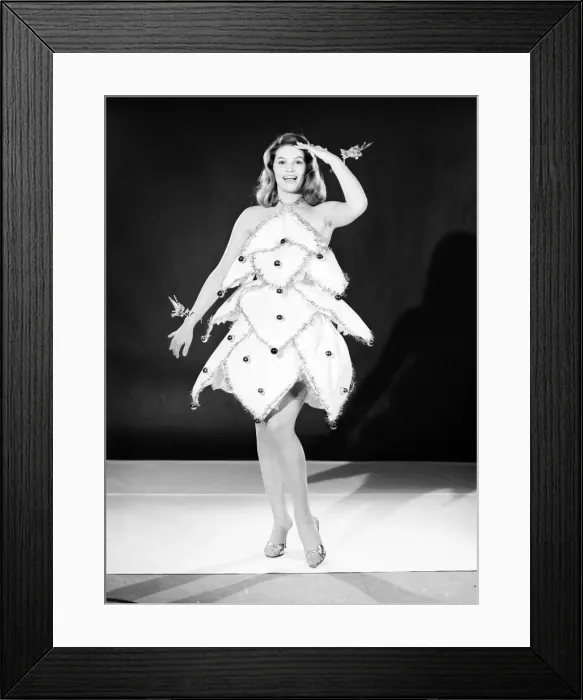 Framed Print : Clothing: Fashion: Dresses: Woman wearing Christmas tree dress. Model: Yvonne Buckingham Framed Print : Clothing: Fashion: Dresses: Woman wearing Christmas tree dress. Model: Yvonne Buckingham