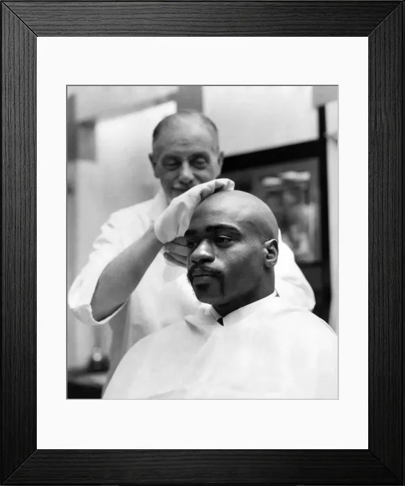 Framed Print : American middleweight boxer Rubin Huricane'Carter having his head shaved Framed Print : American middleweight boxer Rubin Huricane'Carter having his head shaved