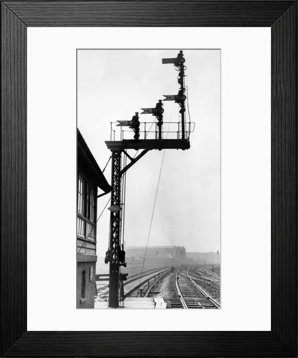 Framed Print : Signals hanging over the railway tracks. March 1963 Framed Print : Signals hanging over the railway tracks. March 1963