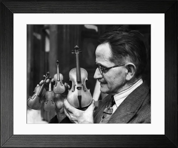 Framed Print : Minatures made exactly to scale held by P. Schneiber. April 1948 Framed Print : Minatures made exactly to scale held by P. Schneiber. April 1948