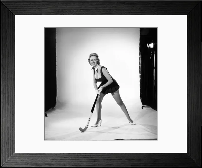 Framed Print : Rita Royce modelling sports kit with hockey stick. Circa 1959 Framed Print : Rita Royce modelling sports kit with hockey stick. Circa 1959