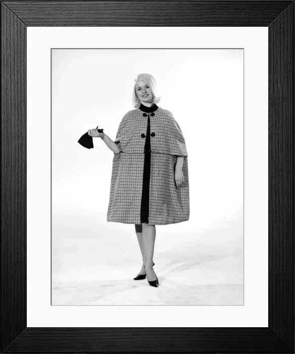 Framed Print : Model Vyvyan Dunbar wearing check cape which can be worn either full length or quarter