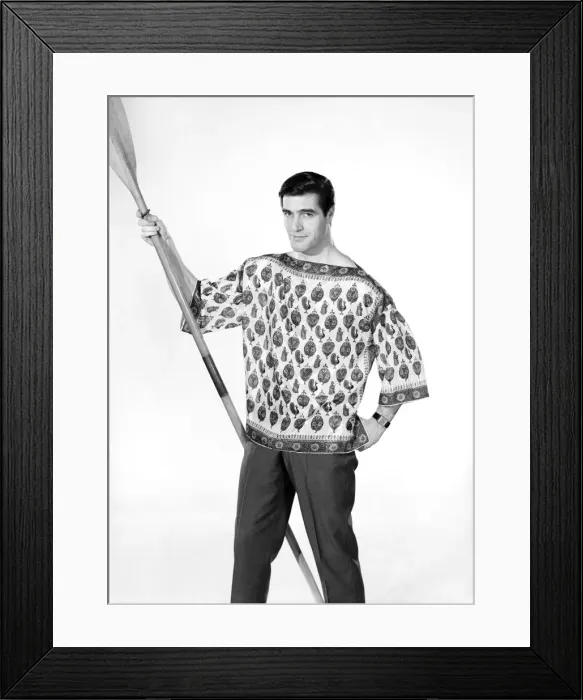 Framed Print : Male model Peter Christian wearing silk shirt seen here holding a oar. Circa 1964 Framed Print : Male model Peter Christian wearing silk shirt seen here holding a oar. Circa 1964