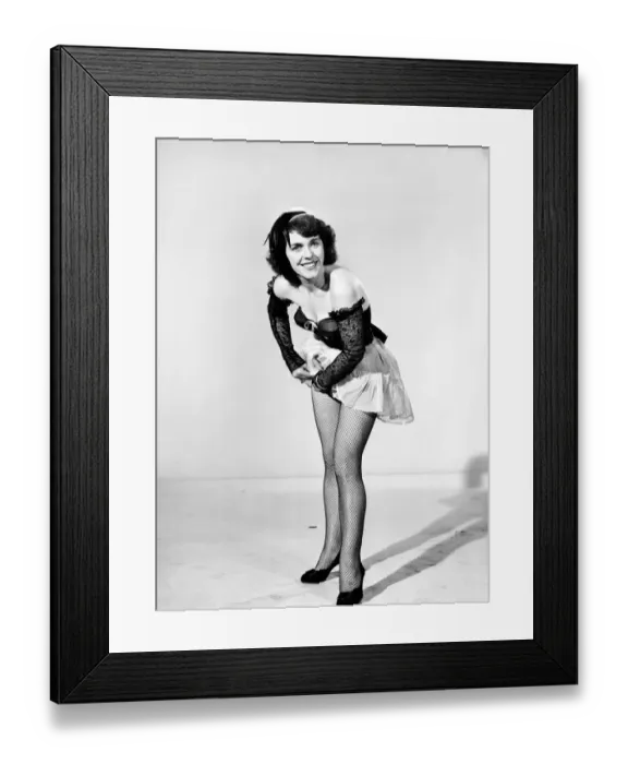 Framed Print : Show girl adjusting suspender. circa 1957