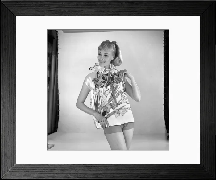 Framed Print : Woman modelling floral blouse. Circa 1960 Framed Print : Woman modelling floral blouse. Circa 1960