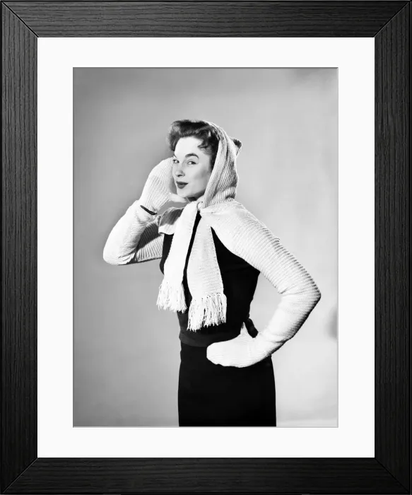 Framed Print : Model wearing combined hooded scarf and gloves. 1955