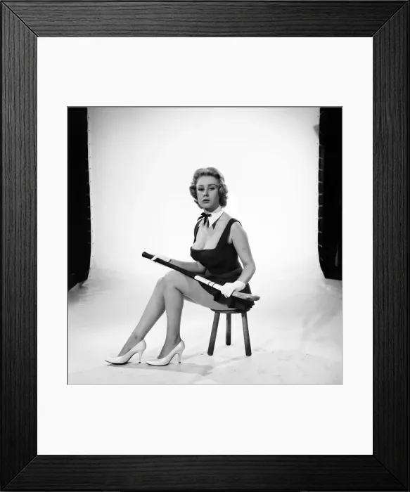 Framed Print : Rita Royce modelling sports kit with hockey stick. Circa 1959 Framed Print : Rita Royce modelling sports kit with hockey stick. Circa 1959