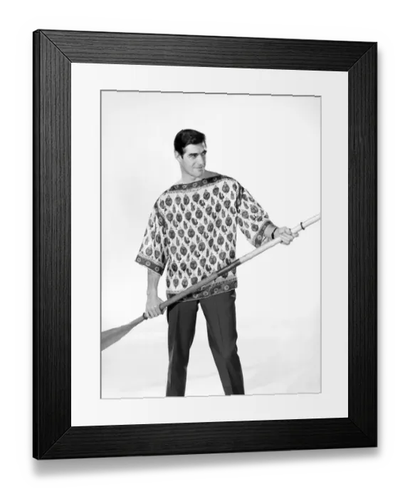 Framed Print : Male model Peter Christian wearing silk shirt seen here holding a oar. Circa 1964 Framed Print : Male model Peter Christian wearing silk shirt seen here holding a oar. Circa 1964