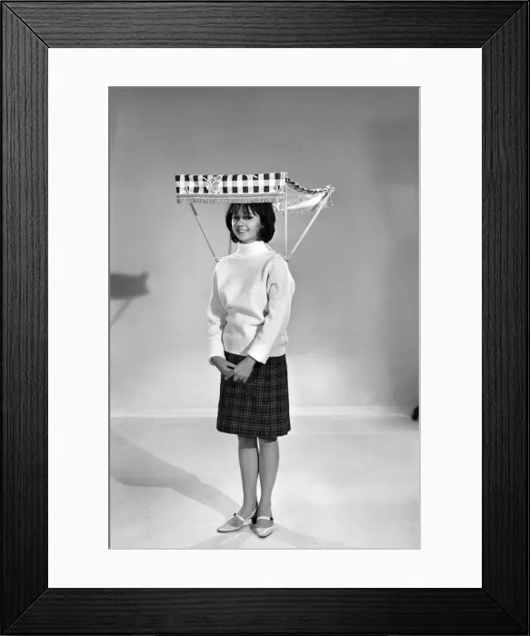 Framed Print : Therese Howard Jones demonstrating the wear-me umbrella. Model. Circa 1959 Framed Print : Therese Howard Jones demonstrating the wear-me umbrella. Model. Circa 1959