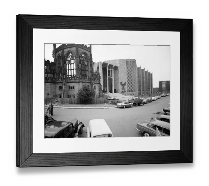 Framed Print : Craftsmen put the finishing touches to the new Coventry Cathedral which stands alongside