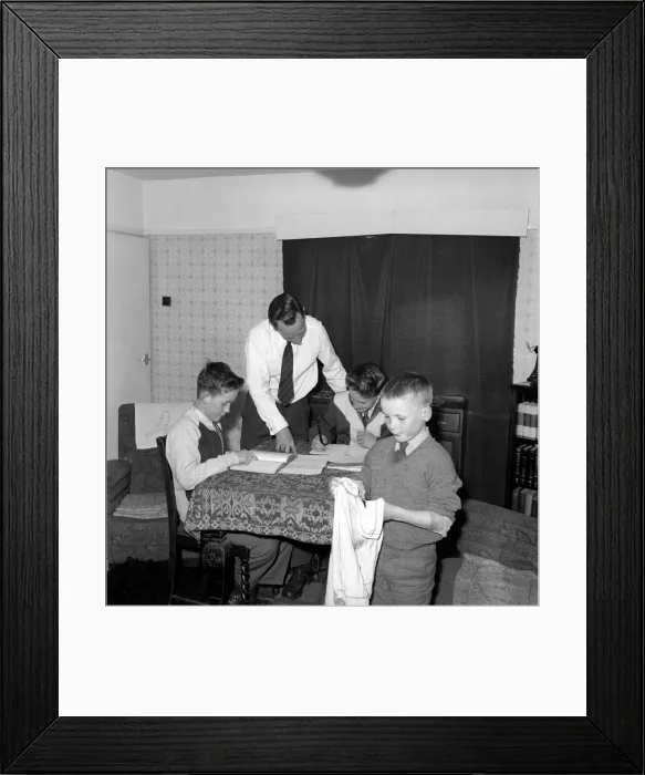 Framed Print : Family Life: Mr. John Theakeston seen here helping his two sons with their school Framed Print : Family Life: Mr. John Theakeston seen here helping his two sons with their school