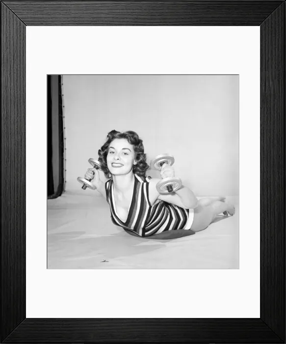 Framed Print : Keep-Fit: Woman exercising with dumb bells. 1960 Framed Print : Keep-Fit: Woman exercising with dumb bells. 1960