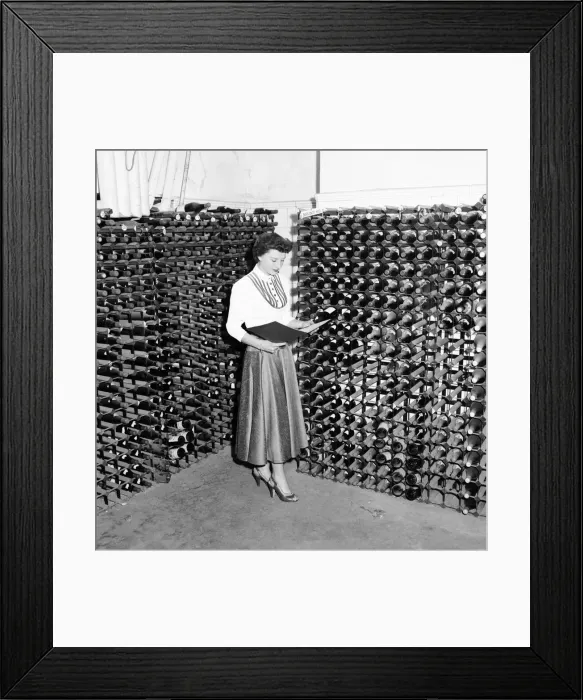 Framed Print : Woman seen here inspecting wine bottles. 1957 A17-002