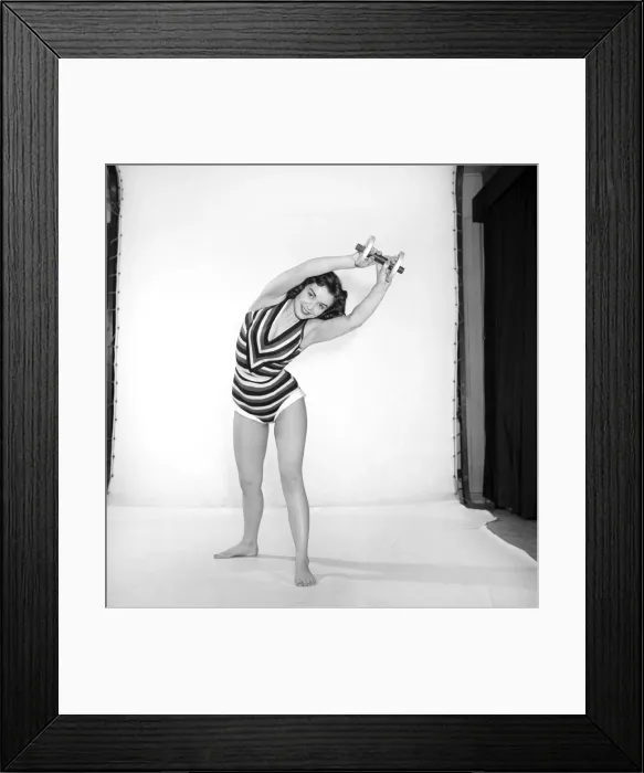 Framed Print : Keep-Fit: Woman exercising with dumb bells. 1960 Framed Print : Keep-Fit: Woman exercising with dumb bells. 1960