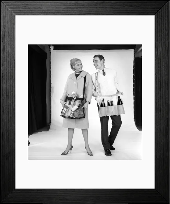 Framed Print : Clothing: Man and woman wearing matching aprons. 1960 B1255