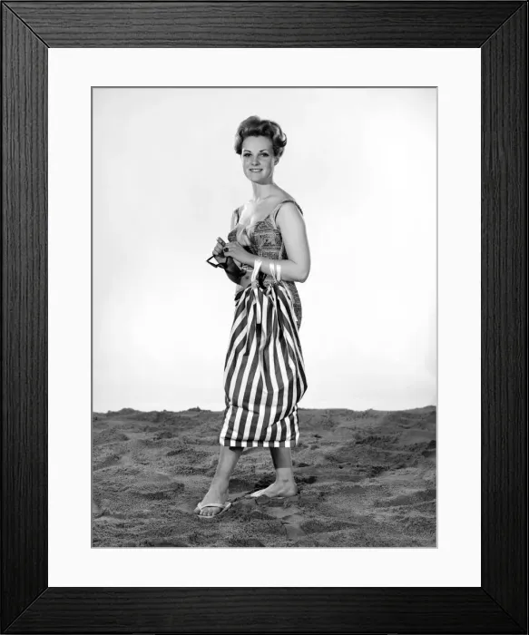 Framed Print : Model Roma Reeves wearing beach toga that doubles as a beach towel. May 1962 Framed Print : Model Roma Reeves wearing beach toga that doubles as a beach towel. May 1962