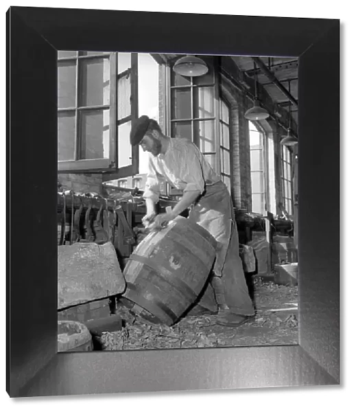Coopers making beer barrels at the Whitbread brewery. October 1958
