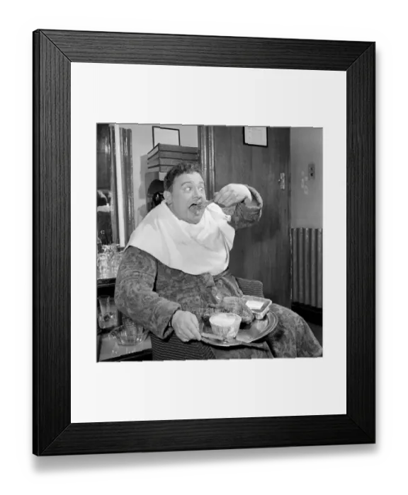 Framed Print : Actor and singer Harry Secombe seen here ordering and then eating a meal order from