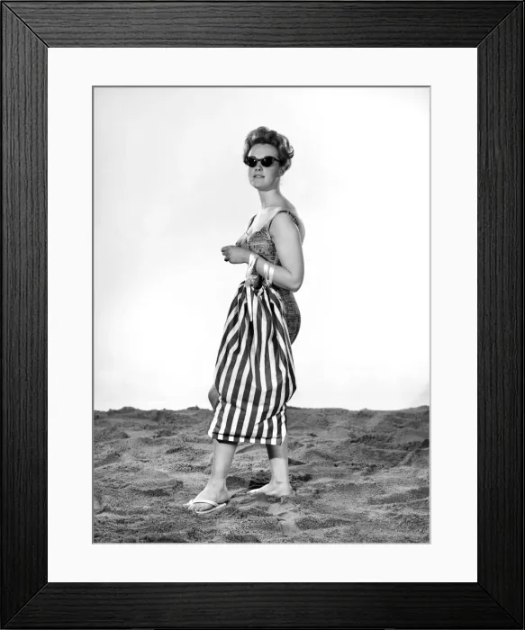 Framed Print : Model Roma Reeves wearing beach toga that doubles as a beach towel. May 1962 Framed Print : Model Roma Reeves wearing beach toga that doubles as a beach towel. May 1962