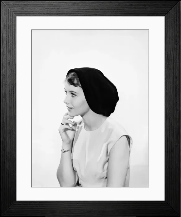 Framed Print : Model Ann Cave wearing a collection of spring and summer hats. Circa 1962