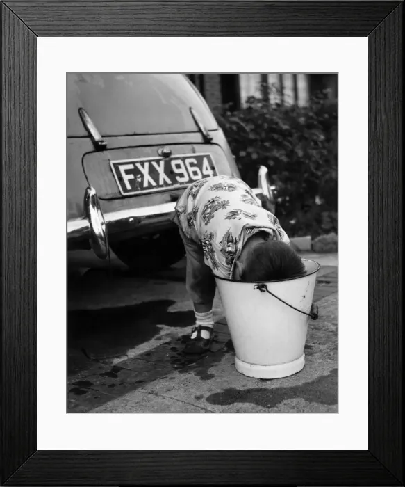 Framed Print : A three and a half year old boy washing fathers car Framed Print : A three and a half year old boy washing fathers car