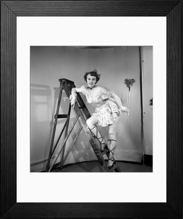 Framed Print : Cleaner wearing fancy dress. 1966 E25-008