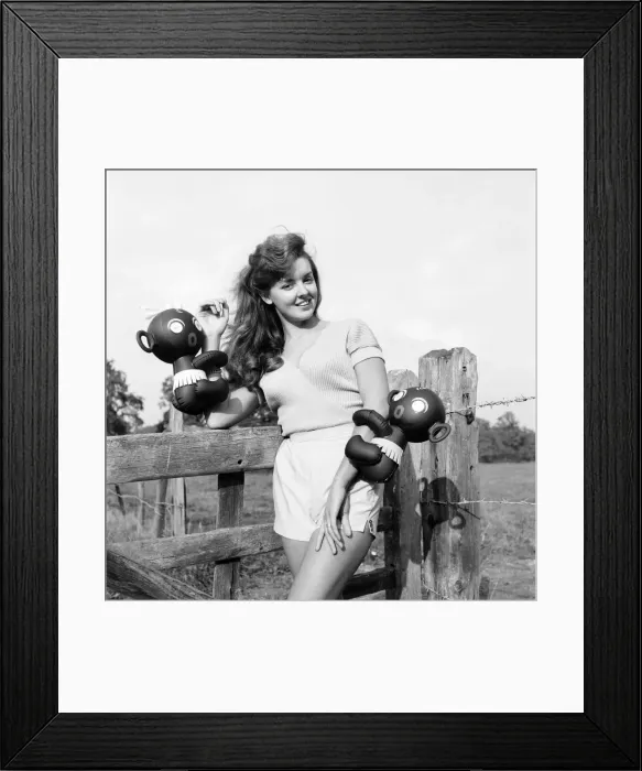 Framed Print : Model Kim Pearson seen here with inflatable alien toys. 1962 E422-004 Framed Print : Model Kim Pearson seen here with inflatable alien toys. 1962 E422-004