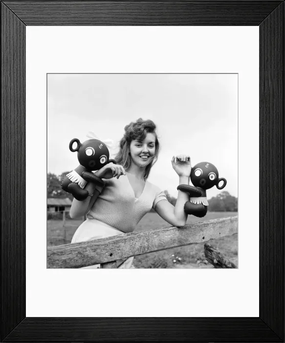 Framed Print : Model Kim Pearson seen here with inflatable alien toys. 1962 E422-007 Framed Print : Model Kim Pearson seen here with inflatable alien toys. 1962 E422-007