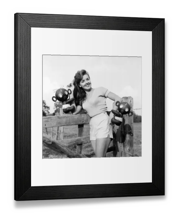 Framed Print : Model Kim Pearson seen here with inflatable alien toys. 1962 E422-008 Framed Print : Model Kim Pearson seen here with inflatable alien toys. 1962 E422-008