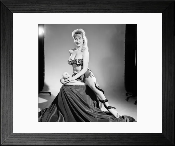Framed Print : Model Carol Gardener as Eve about to take a bite from the apple. 1960 E421-003 Framed Print : Model Carol Gardener as Eve about to take a bite from the apple. 1960 E421-003