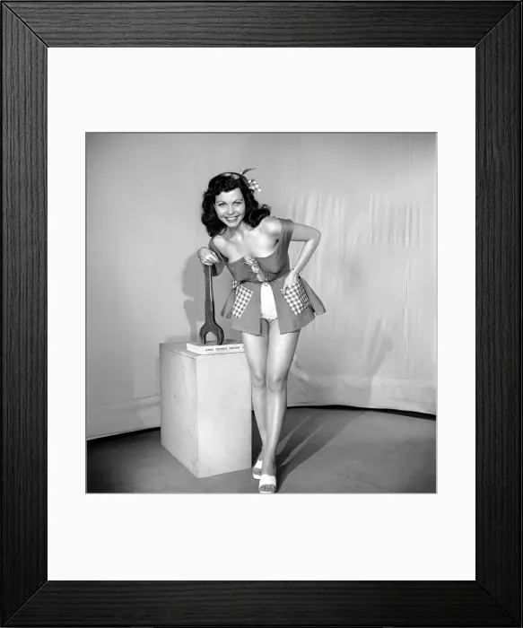 Framed Print : The Mechanic: Woman in fancy dress holding large spanner. 1959 E40-001 Framed Print : The Mechanic: Woman in fancy dress holding large spanner. 1959 E40-001