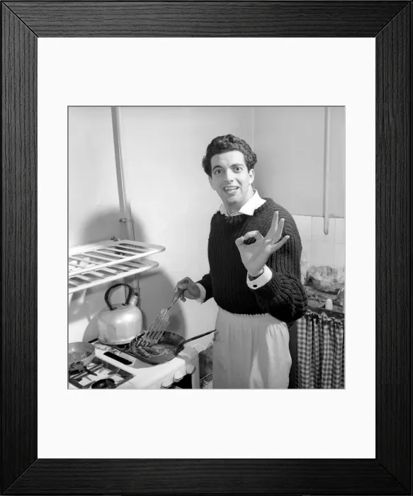 Framed Print : Singer Frankie Vaughan seen here at home cooking breakfast for his family. Circa 1957