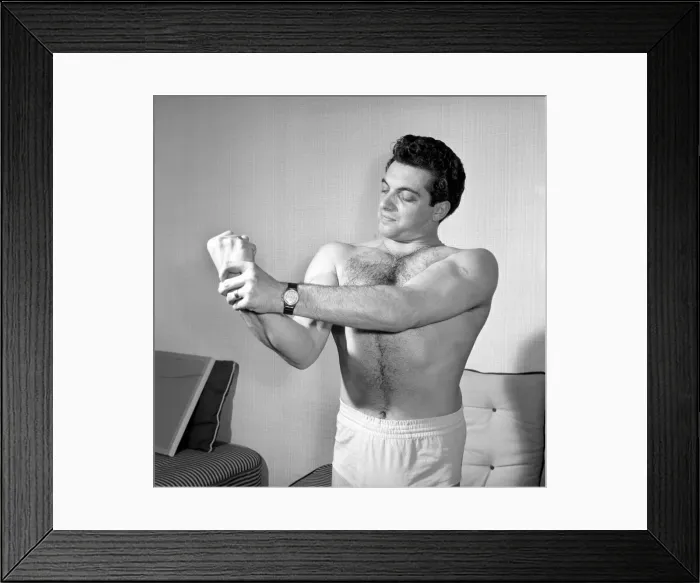 Framed Print : Singer Frankie Vaughan seen here exercising at home. Circa 1957