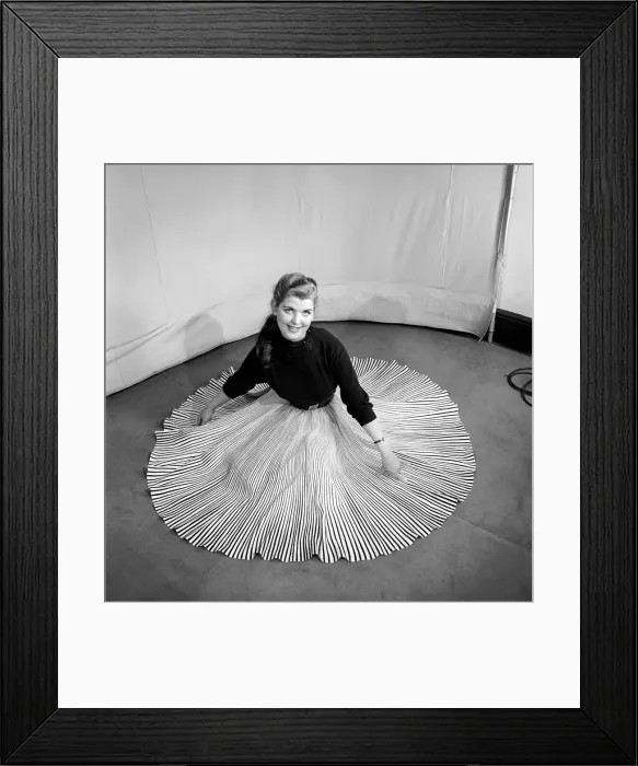 Framed Print : Clothing: Fashion: Skirts: Woman wearing pleated skirt. 1953 B127-001