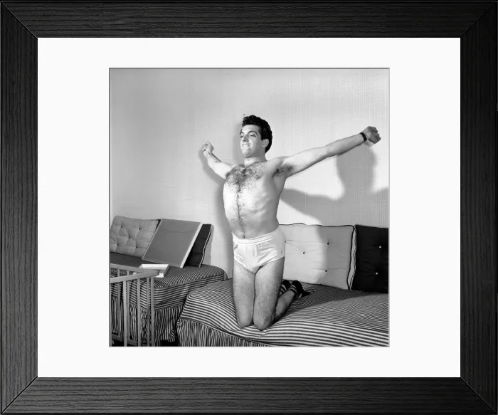 Framed Print : Singer Frankie Vaughan seen here exercising at home. Circa 1957