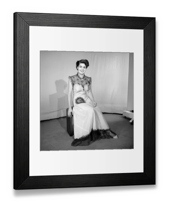 Framed Print : Woman modelling the latest evening dress fashions in the Reveille studios