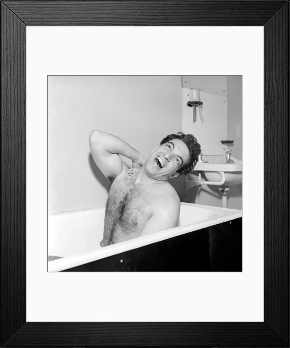 Framed Print : Singer Frankie Vaughan seen here singing in the bath at the family home. Circa 1957 Framed Print : Singer Frankie Vaughan seen here singing in the bath at the family home. Circa 1957