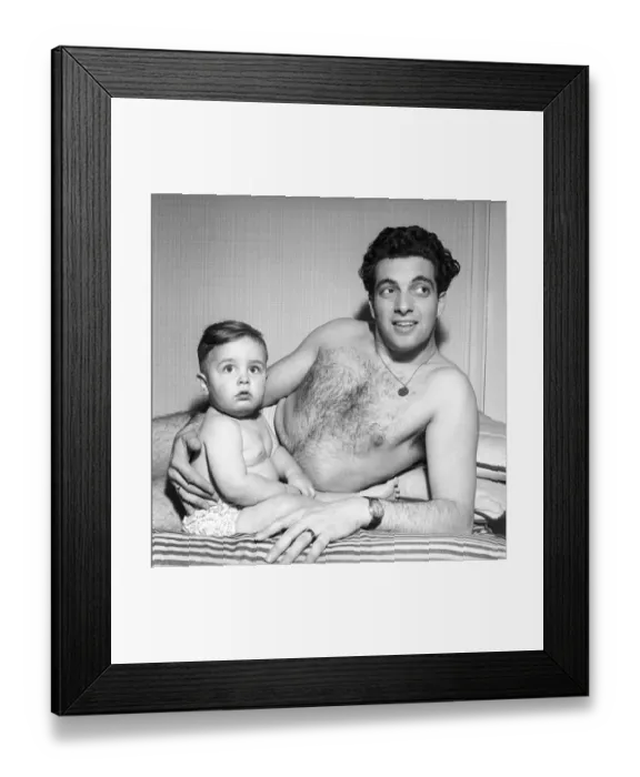Framed Print : Singer Frankie Vaughan seen here playing with his son David. Circa 1957